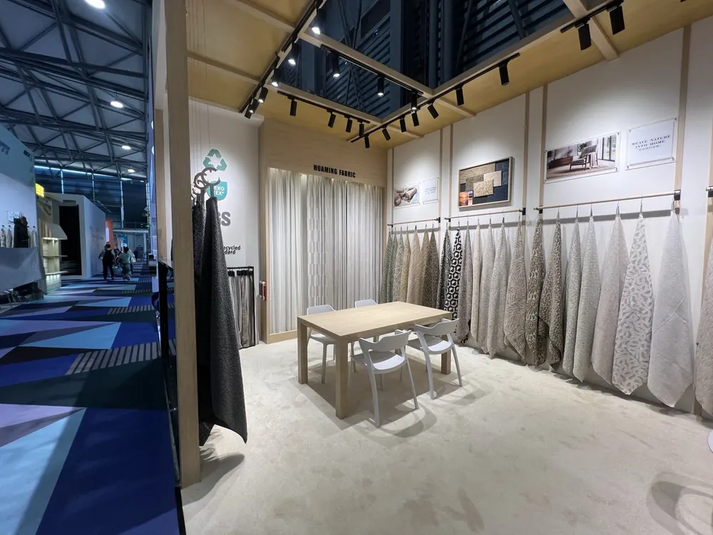 Huaming Fabric meeting corner with swatch walls, Shanghai furniture fair 2026