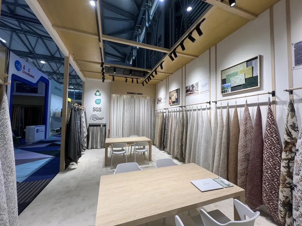 Two development meeting tables inside the Huaming booth, Shanghai 2026