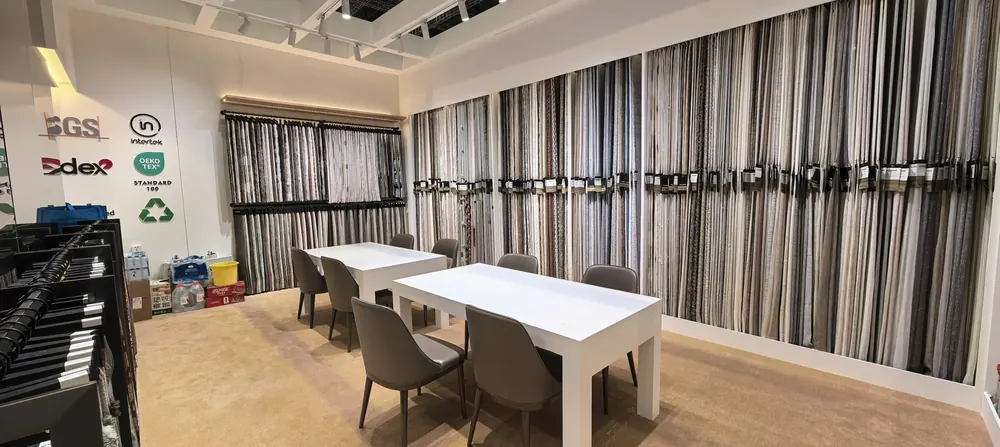 SGS, OEKO-TEX and GRS certification marks at the Huaming Fabric booth, Shanghai 2026