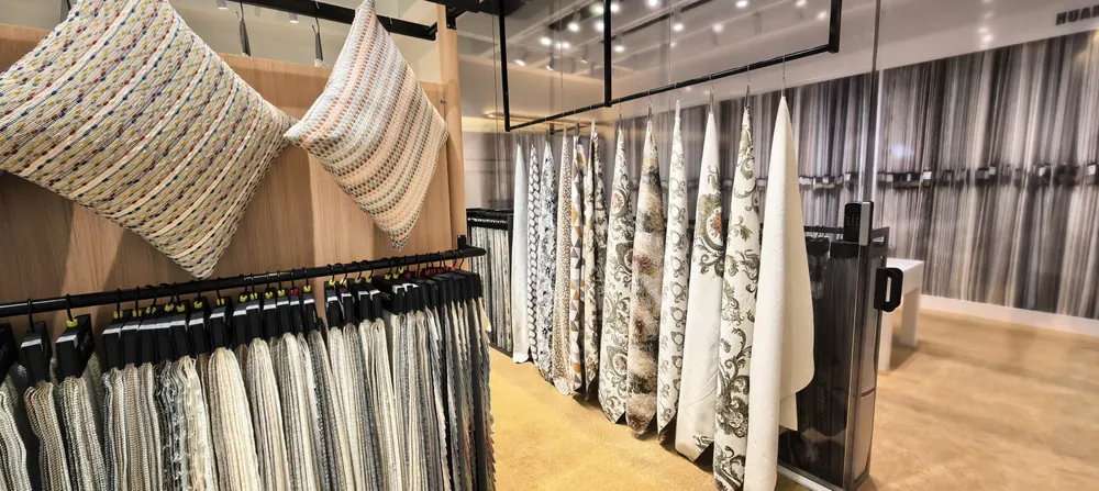 Jacquard and chenille decorative cushions displayed by Huaming Fabric, Shanghai home textile fair 2026